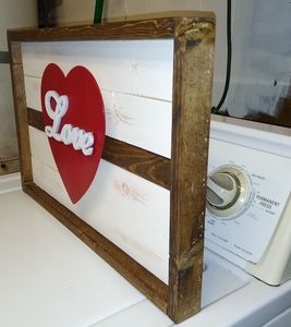Rustic wooden frame with floating heart